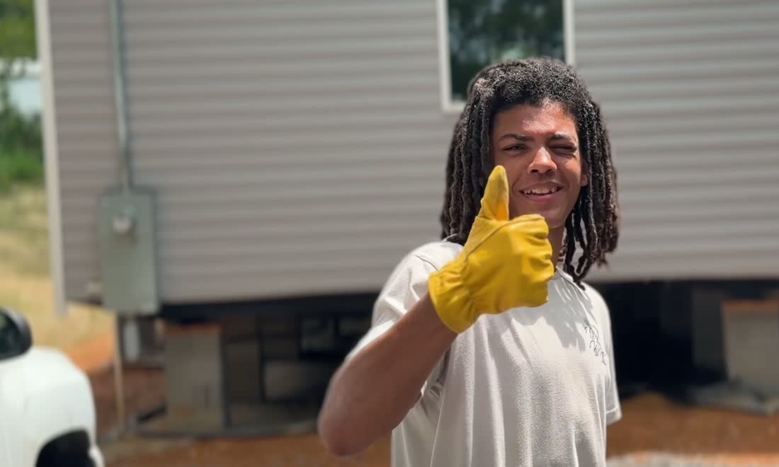 TG Services owner giving a thumbs up after finishing a job